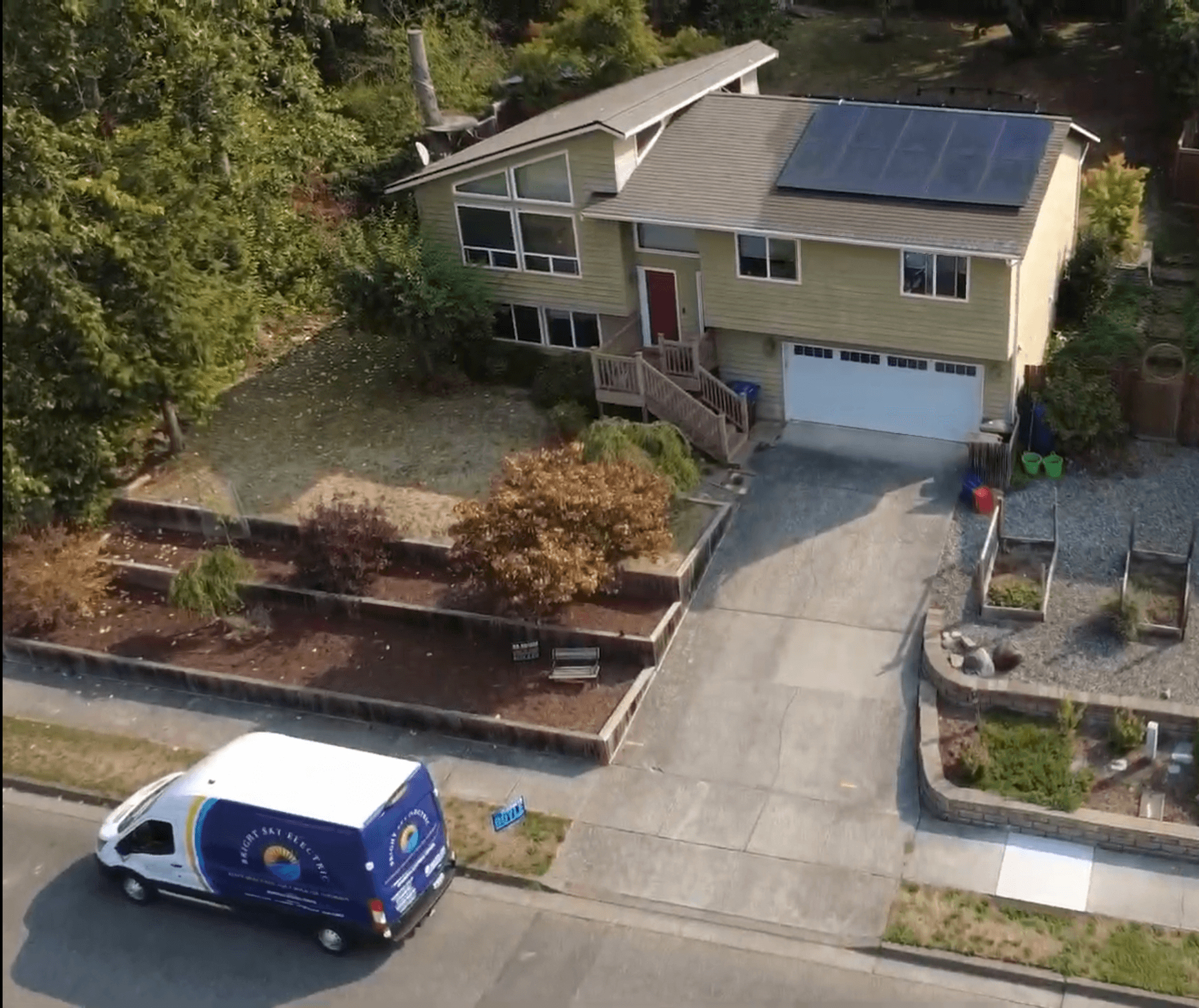 bright sky van in front of a house with solar