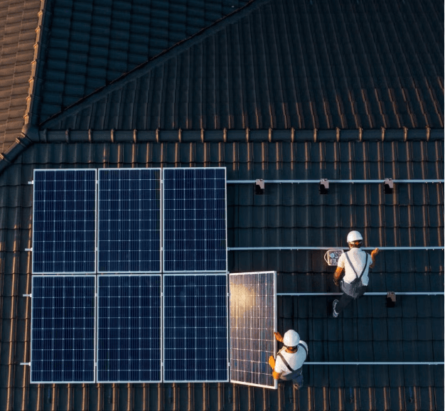 men laying solar panels